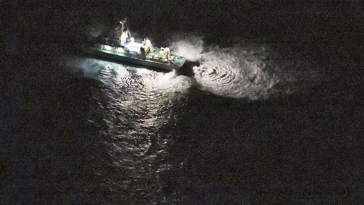 A boat with lights at night