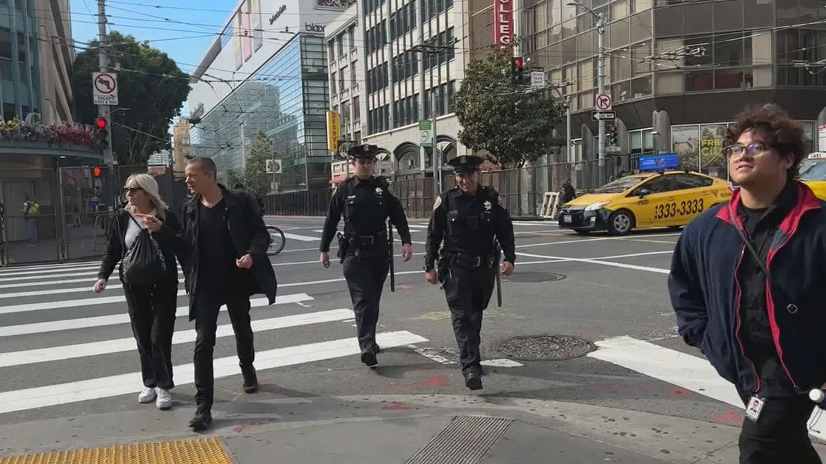 SFPD officers on street corner near APEC summit