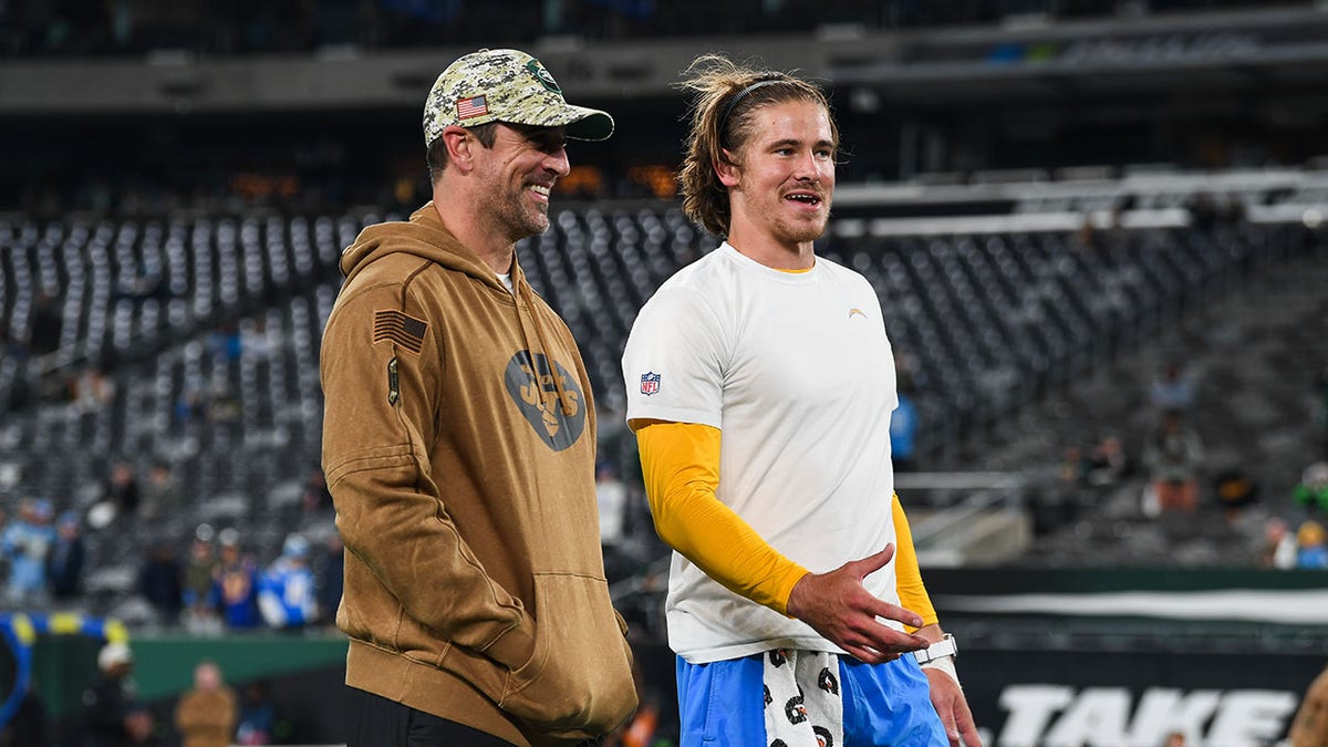 Aaron Rodgers talks with Justin Herbert