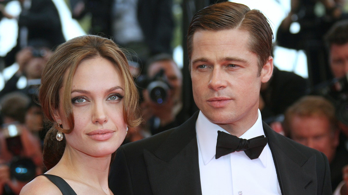 Angelina Jolie and Brad Pitt attend a premiere