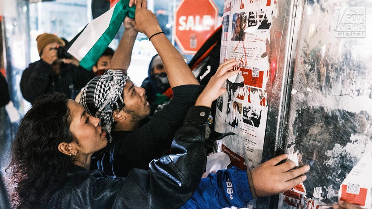 Protesters tear down kidnapped Israeli posters