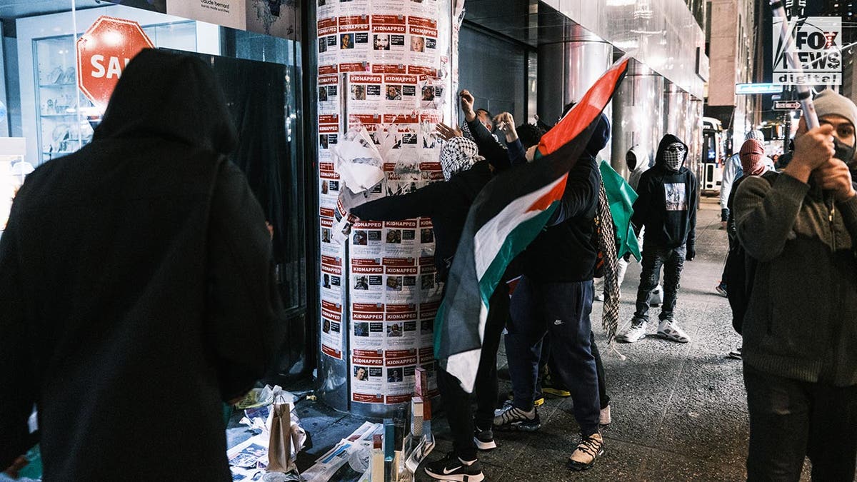 The viral videos of anti-Israel and pro-Palestinian protestors tearing down posters of civilians taken by Hamas during the October 7 terrorist attack have inundated social media, and at least one journalism watchdog has accused The New York Times of "both-siding" the issue.