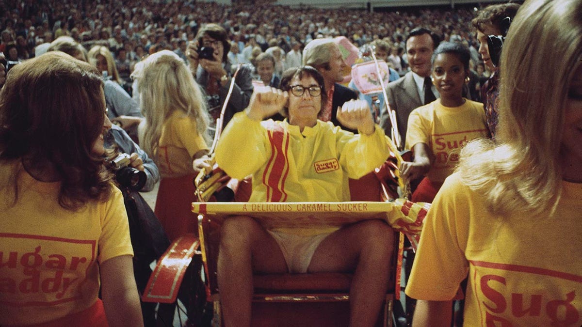 Bobby Riggs waves to crowd