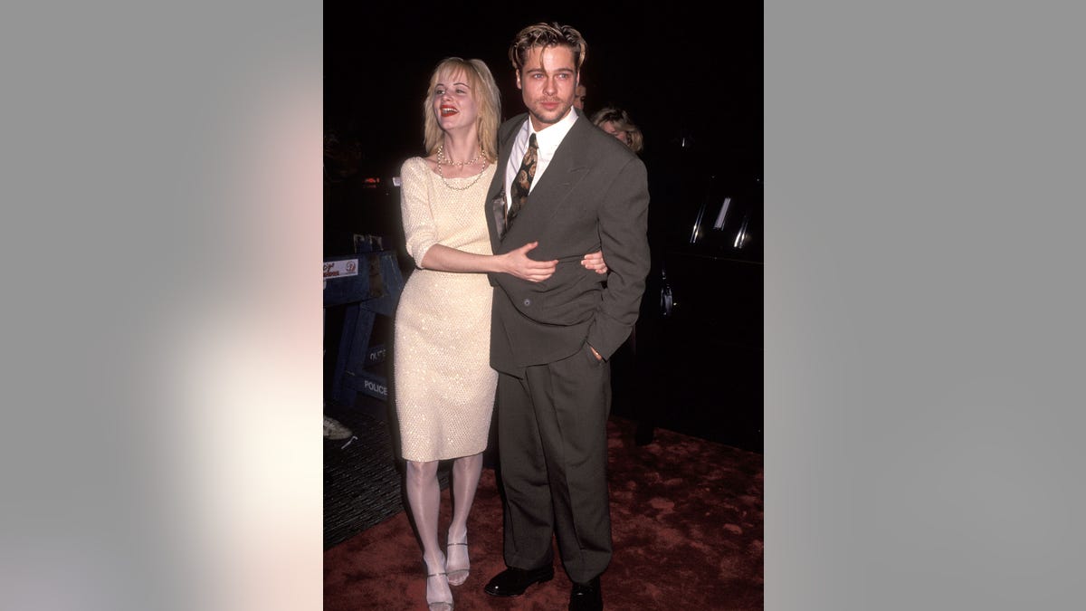 Juliette Lewis and Brad Pitt attend a premiere