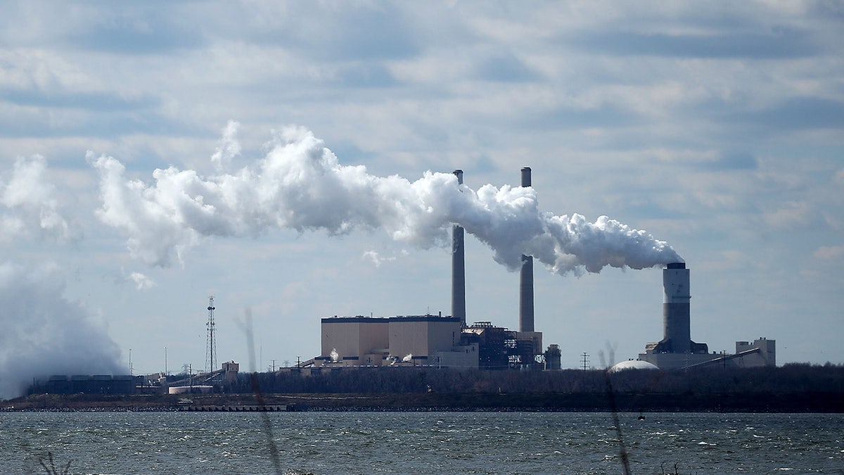 Emissions spew from a large stack at the coal fired Brandon Shores Power Plant