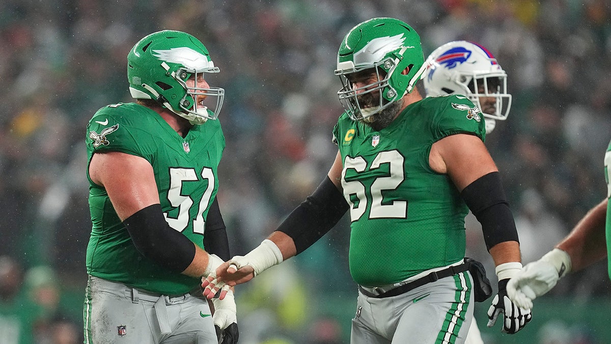 Cam Jurgens and Jason Kelce celebrate during Eagles game