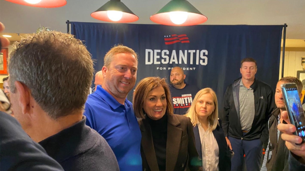 IA Gov. Kim Reynolds with supporter in Davenport, IA on Nov. 7.