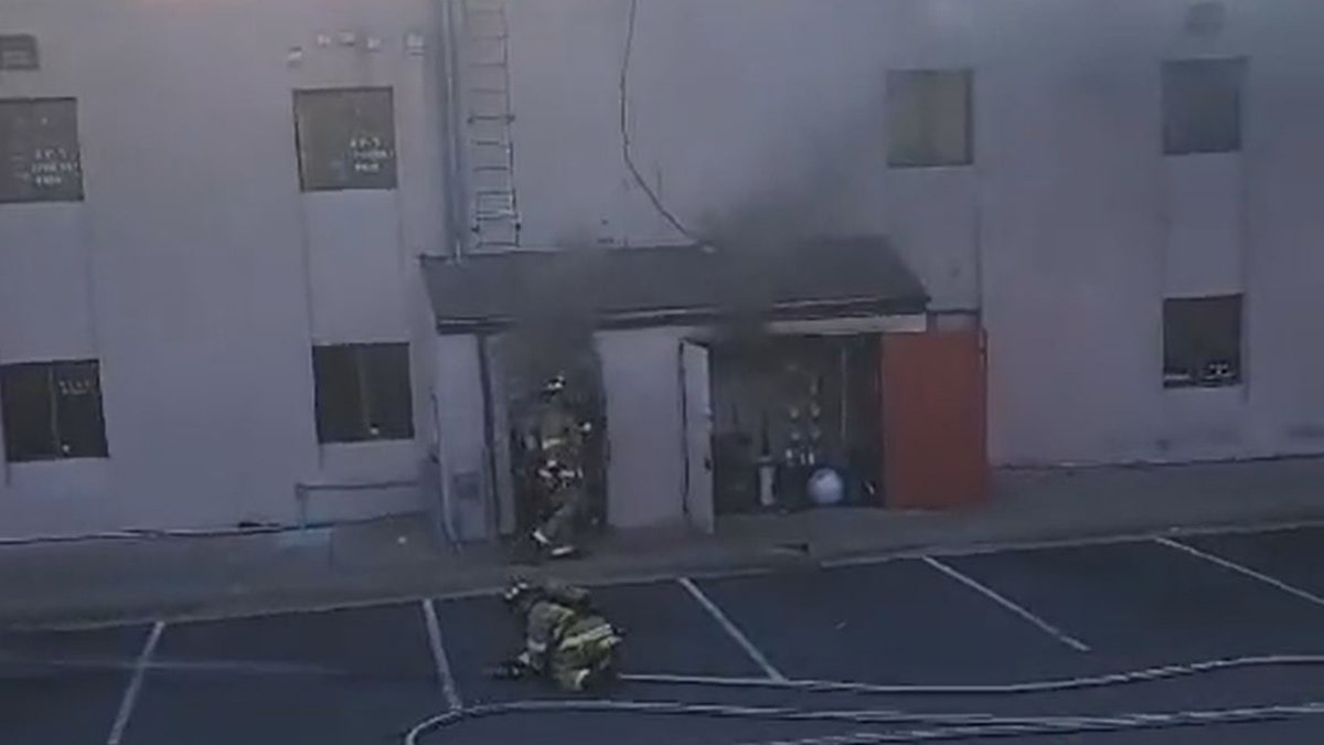 Firefighter seen opening door second before blast