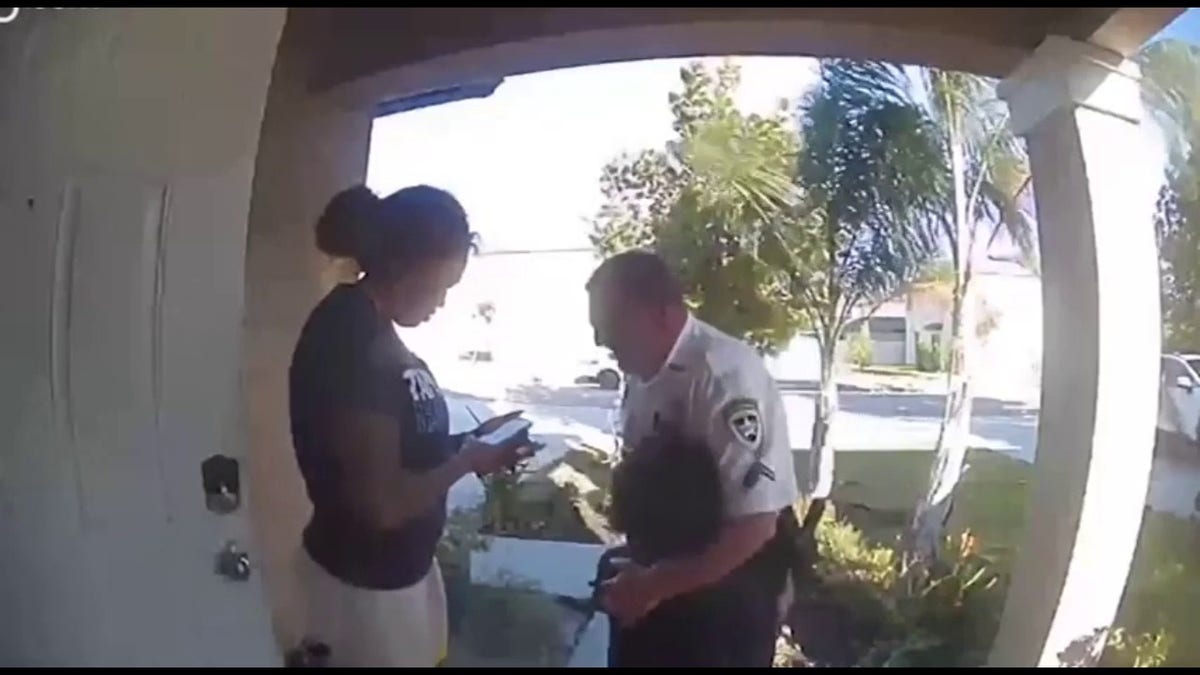 A child could be seen hugging a deputy