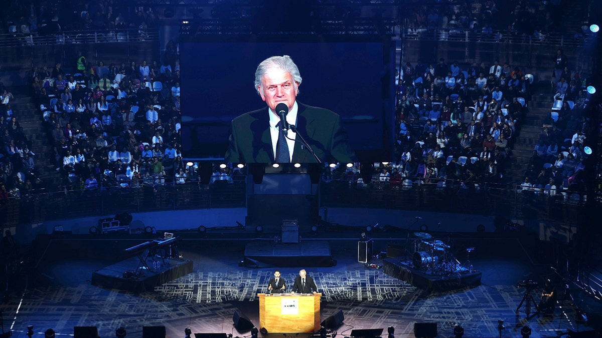 arena with Franklin Graham on jumbotron