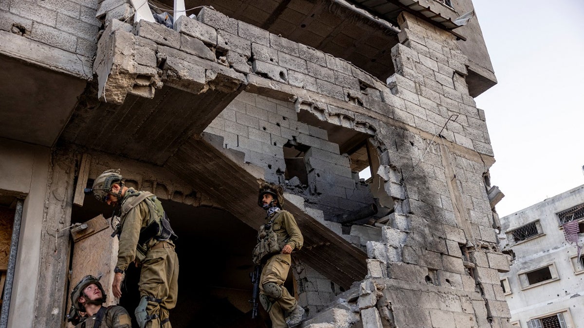 Israeli soldiers in a bombed out building in Gaza