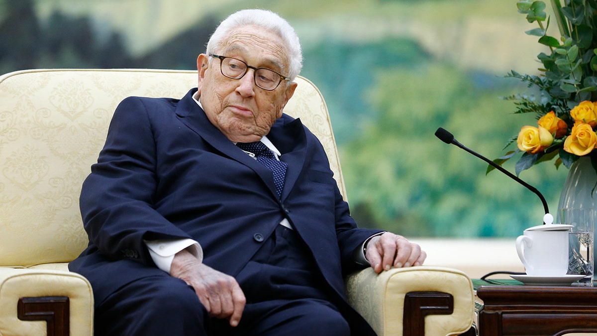 Kissinger sitting