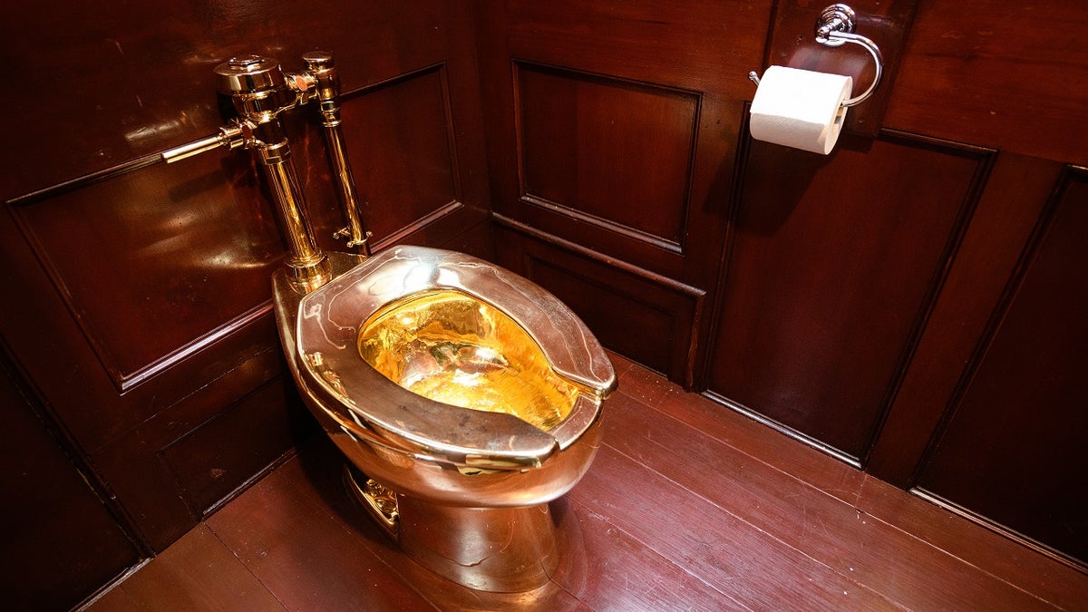 "America," a fully-working solid gold toilet, created by Maurizio Cattelan, is seen at Blenheim Palace on Sept. 12, 2019 in Woodstock, England.