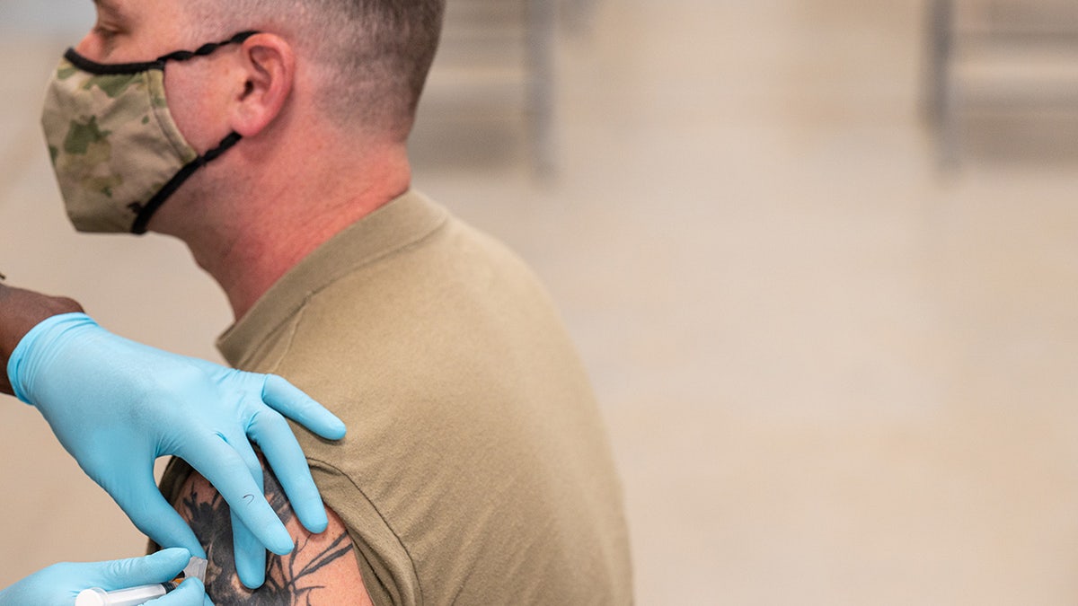 covid vaccine administered to soldier