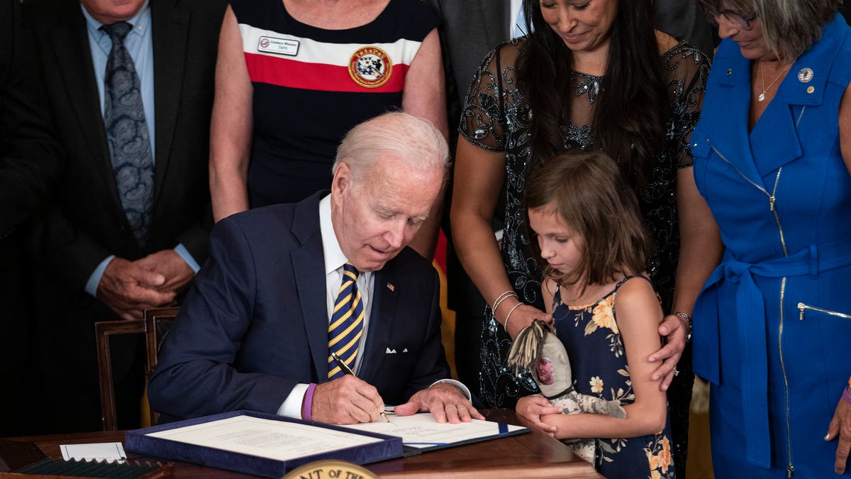 President Biden signing the PACT Act