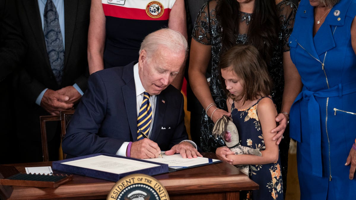 President Biden signing the PACT Act