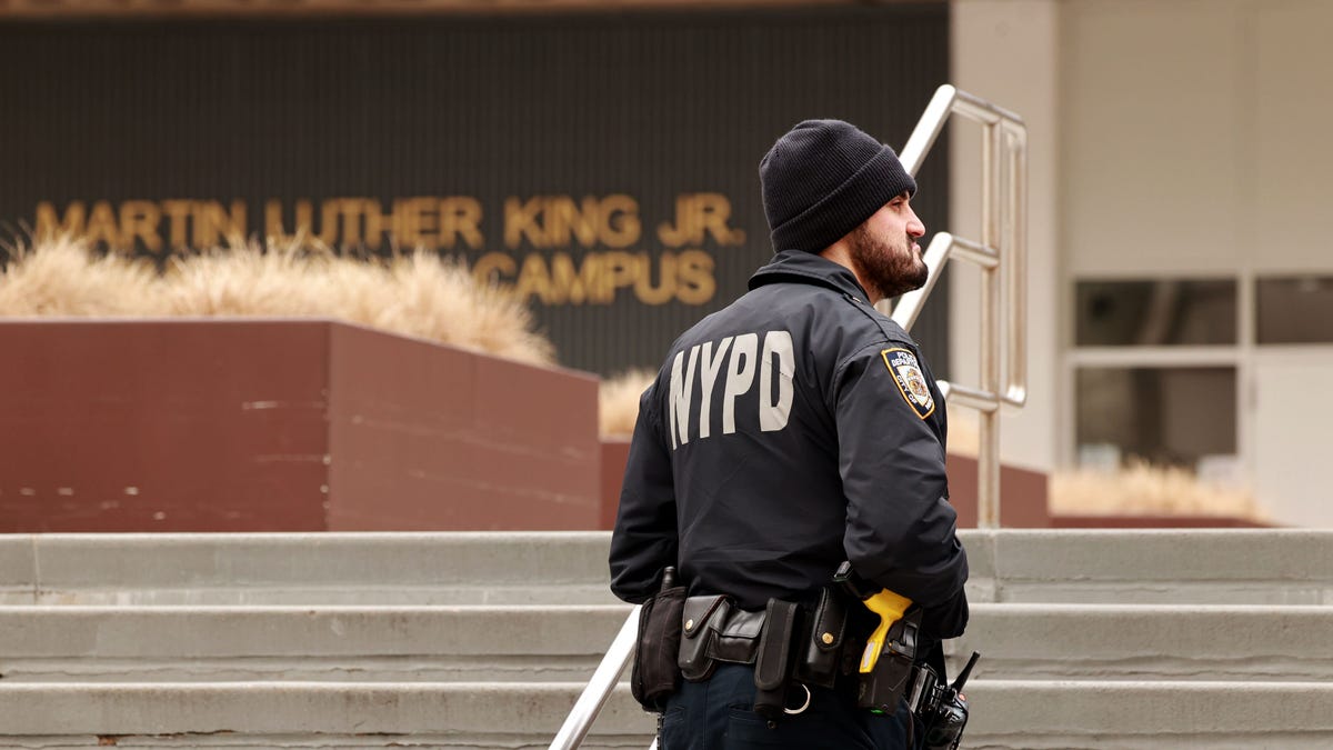 NYPD officer in front of high school in New York City