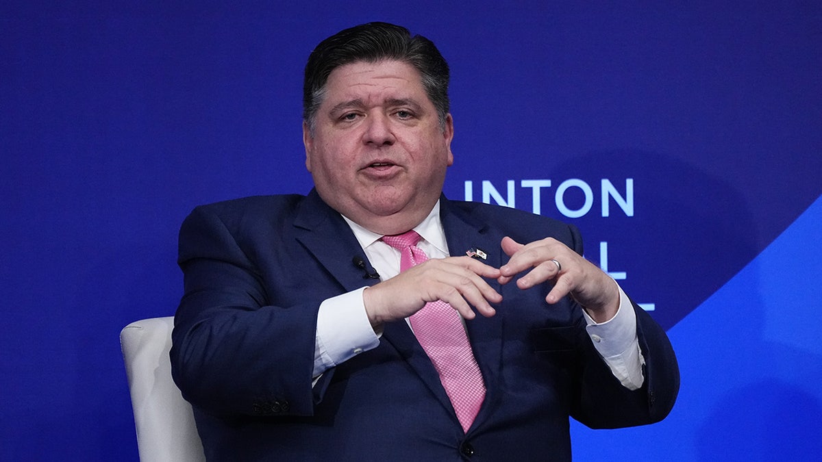 Pritzker speaking at event