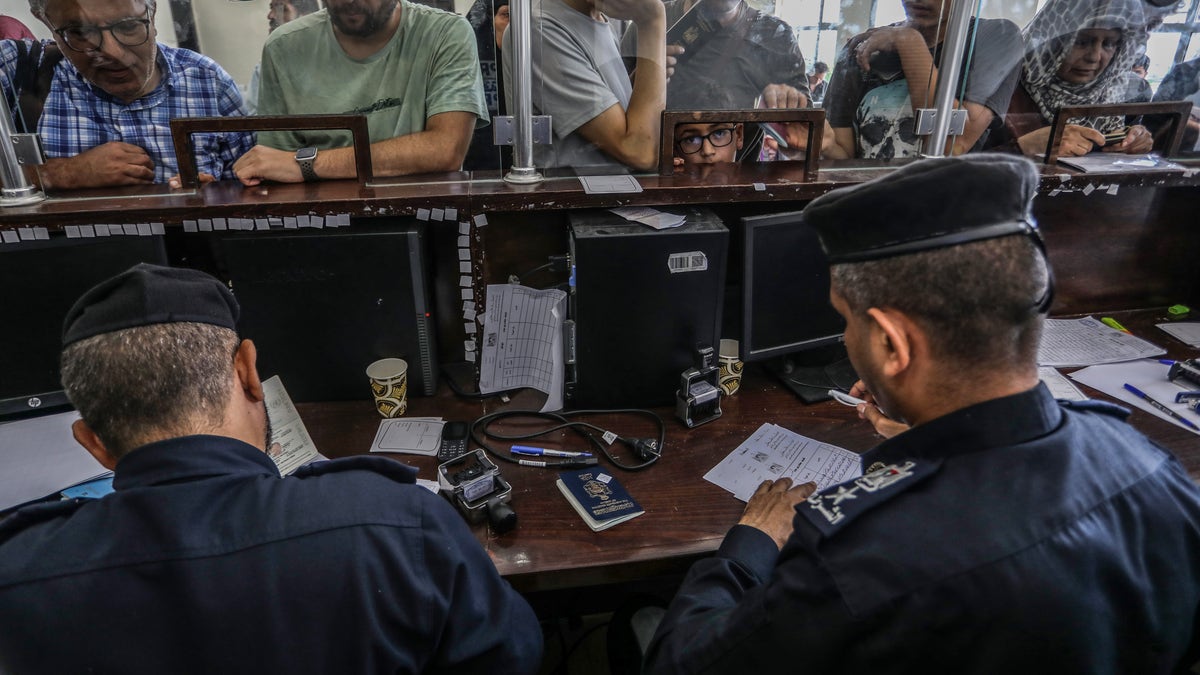 foreign passport holders go through customs at rafah border crossing