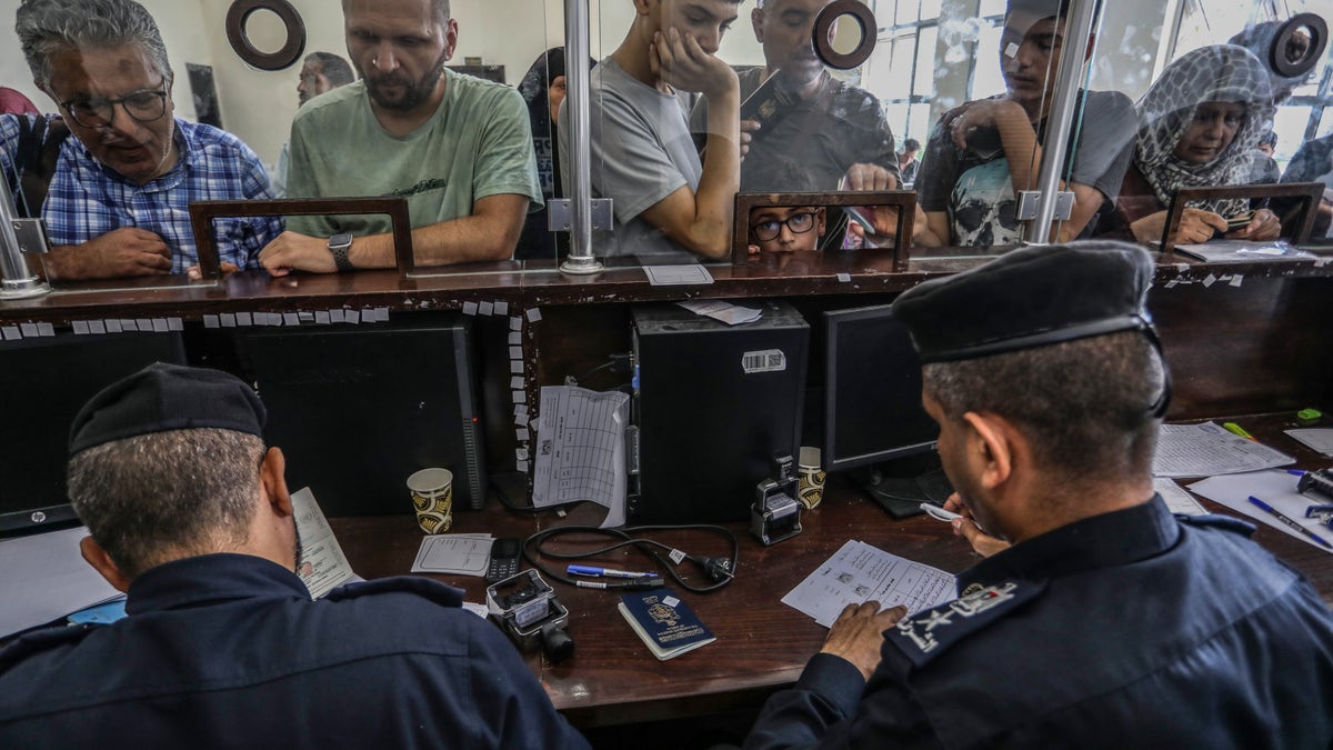 foreign passport holders go through customs at rafah border crossing