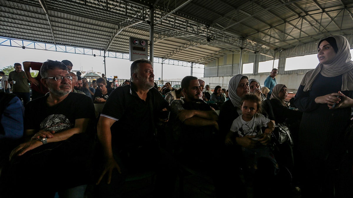 Egyptian officials process those fleeing Gaza