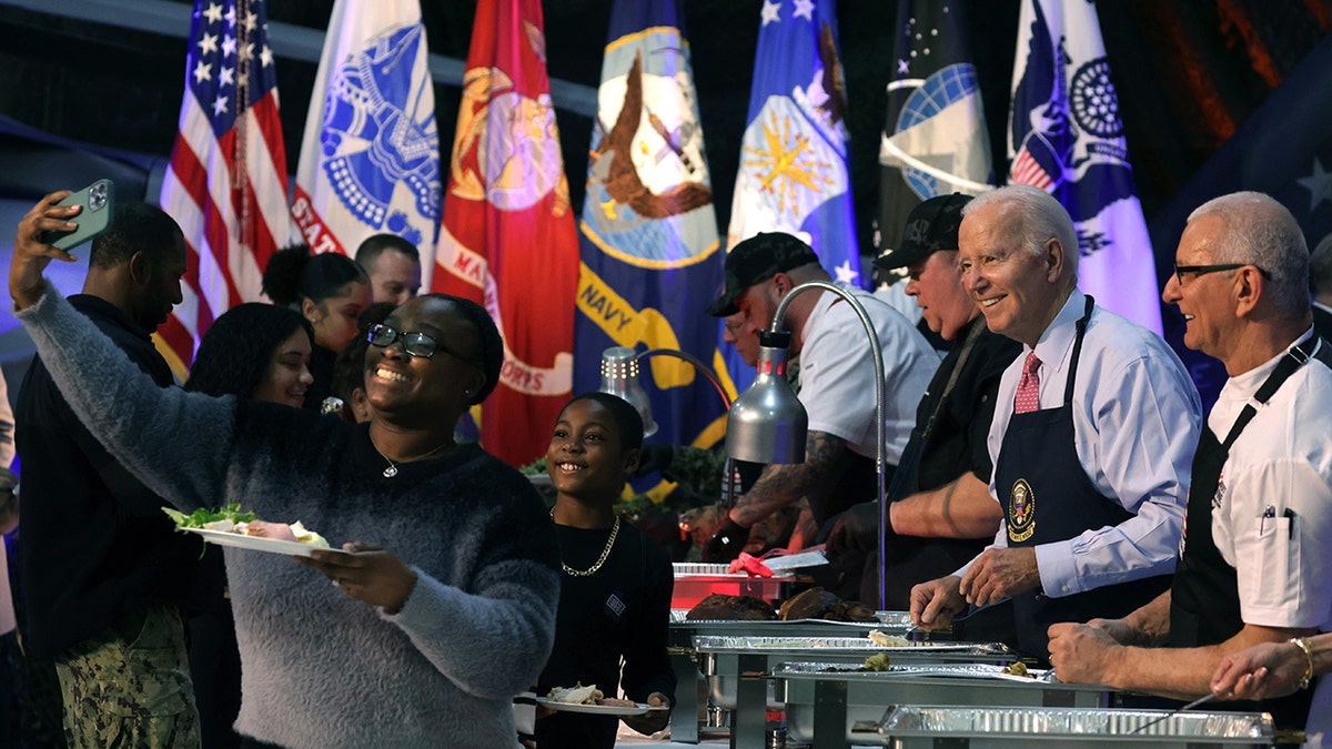 Biden serving food, military flags
