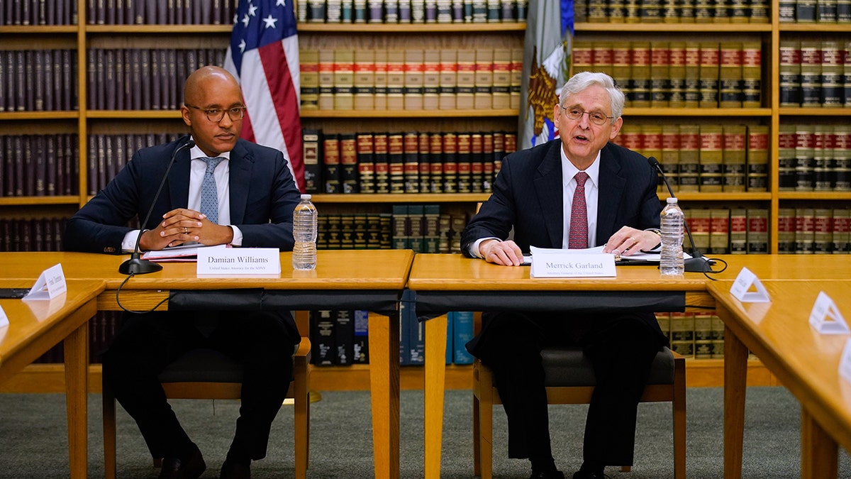 Williams, Garland sitting at a table