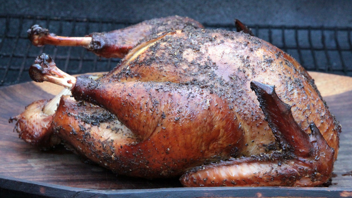 A smoked turkey on a platter