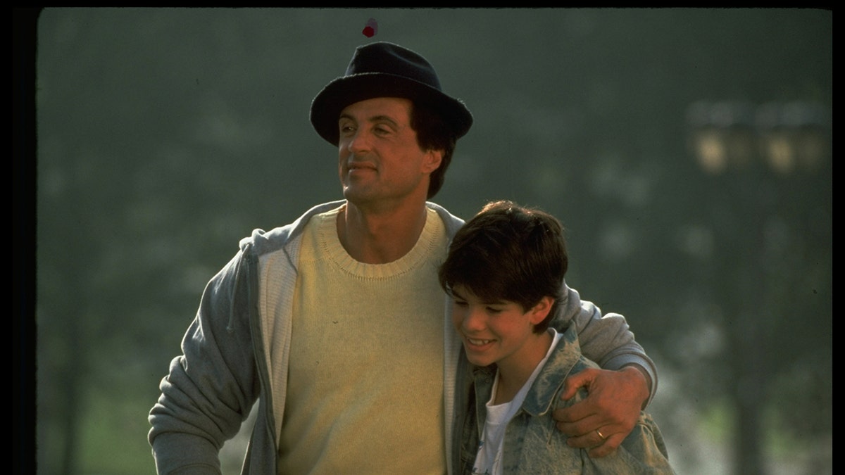 Sylvester Stallone and Sage Stallone in a scene from Rocky V