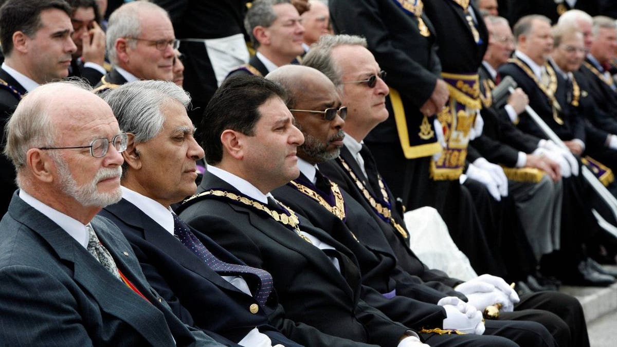 Freemasonry sitting in a row