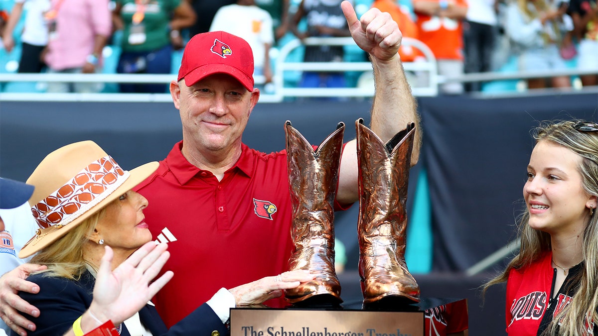 Jeff Brohm with The Schnellenberger Trophy