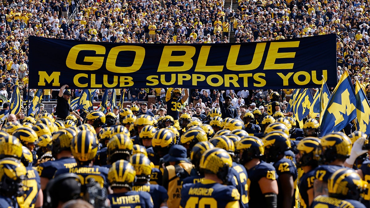 Michigan players take the field