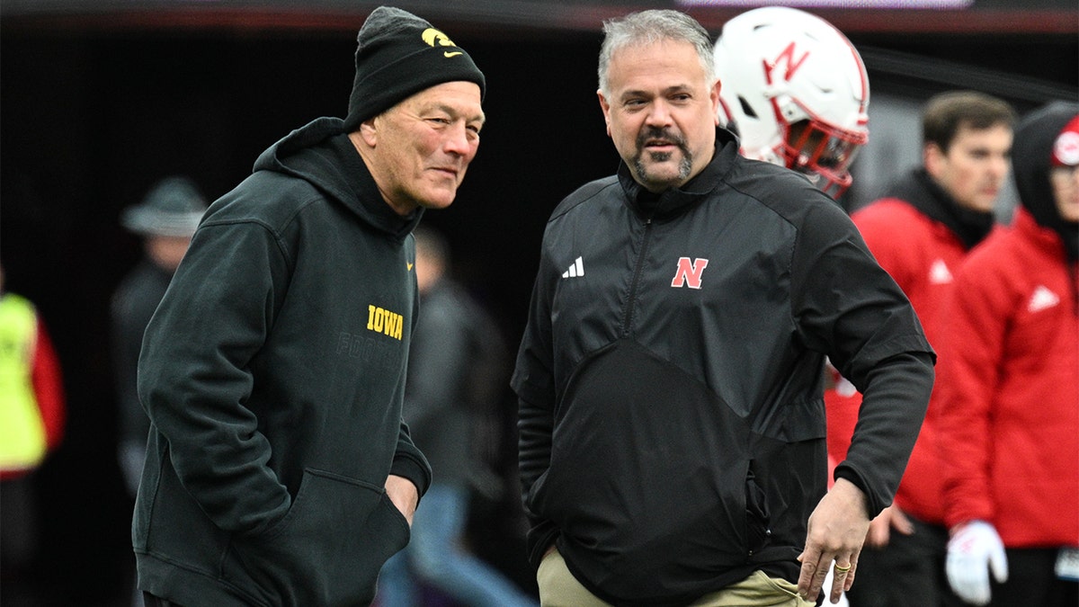 Matt Rhule talks with Kirk Ferentz