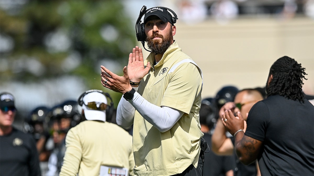 Sean Lewis coaches against USC