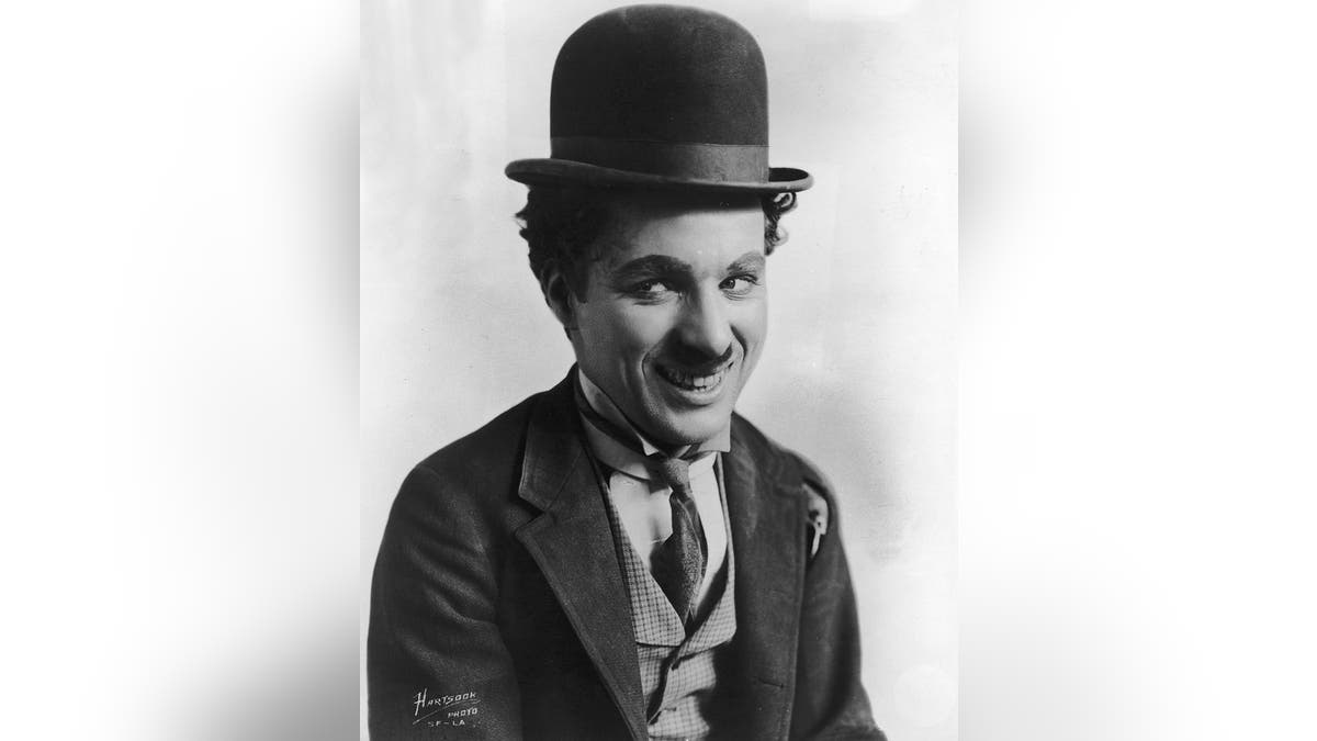 Charlie Chaplin dressed as The Tramp