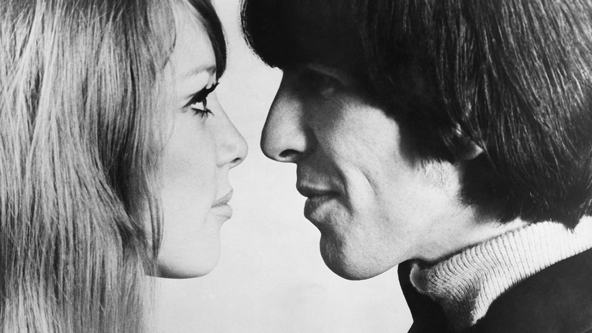 A close-up of Pattie Boyd staring at George Harrison