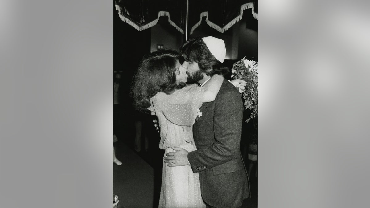 Henry Winkler and Stacey kissing on their wedding day