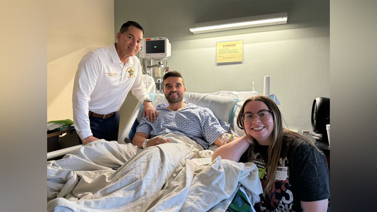 Cpl. Carlos Brito pictured with his wife in a hospital
