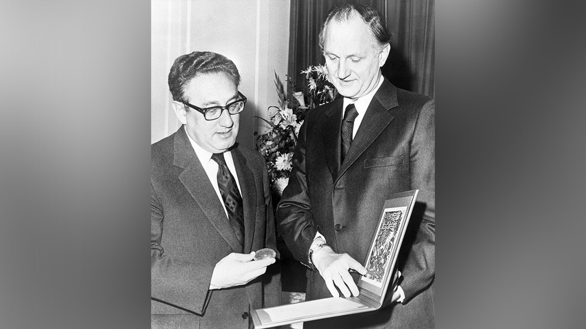 Dr. Henry Kissinger receiving his Nobel Peace Prize