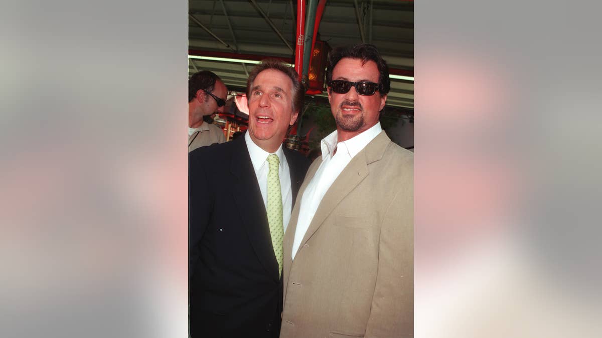 Henry Winkler and Sylvester Stallone posing together