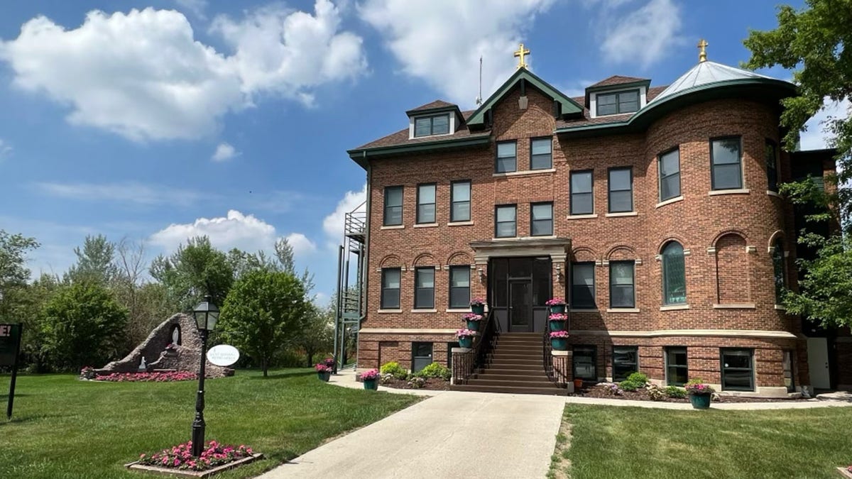 brick home with cross on top