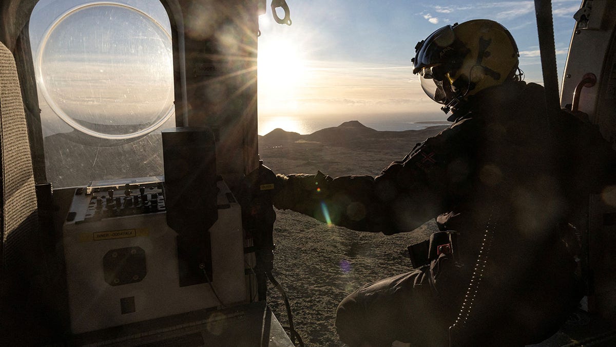 Helicopter flies near evacuated Grindavik, Iceland