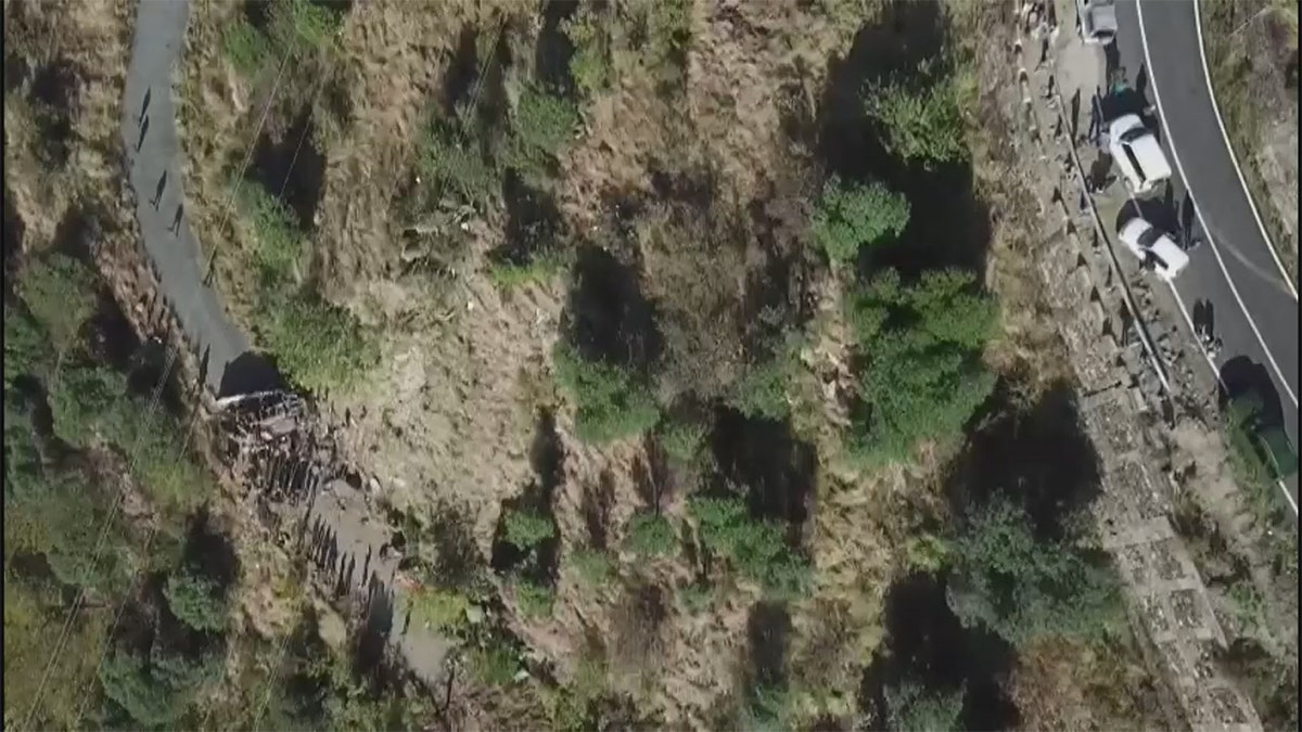 an aerial shot of where a bus in India plunged into a gorge