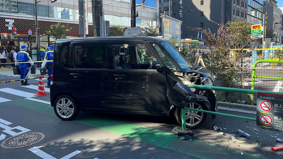 Van damaged after striking barrier in Tokyo