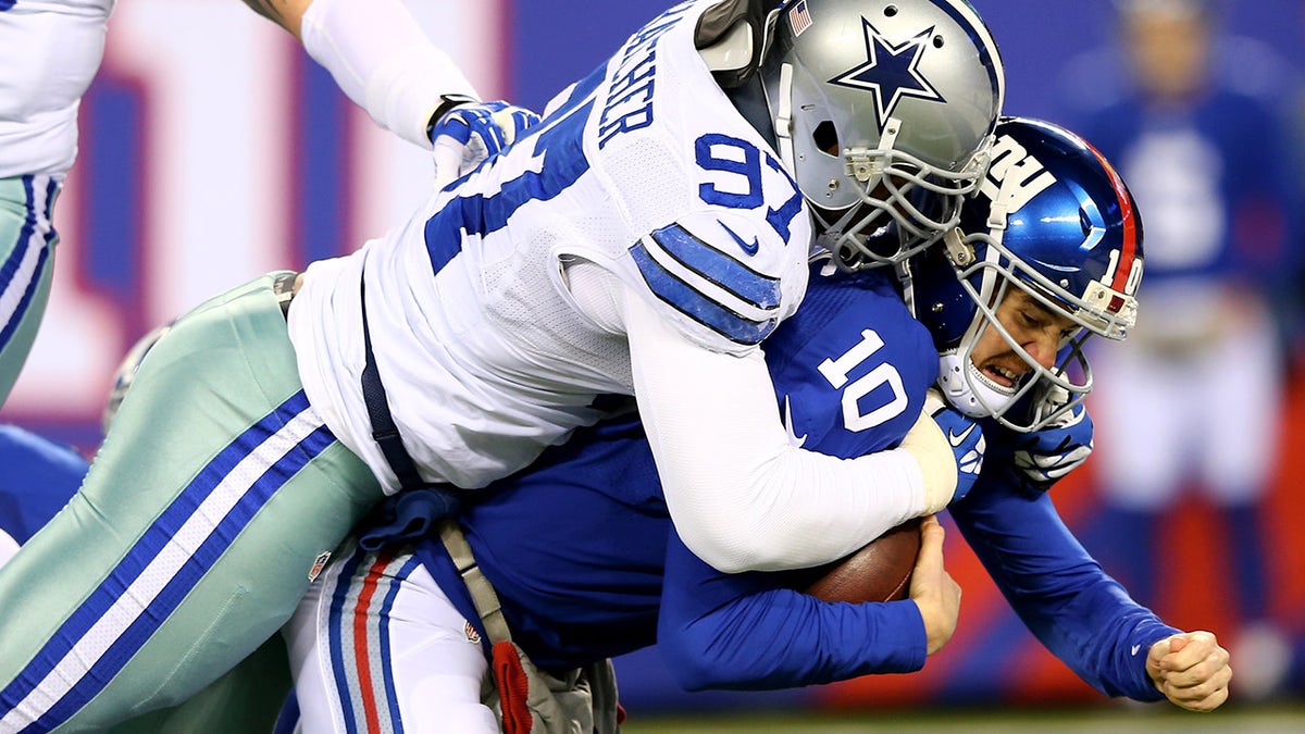 Jason Hatcher and Eli Manning