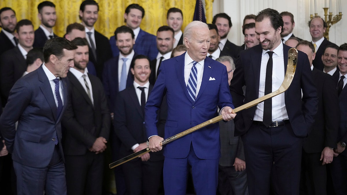 Biden looks at the stick