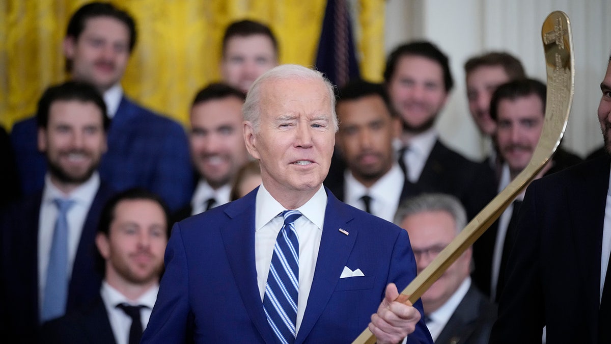 Joe Biden holds the stick