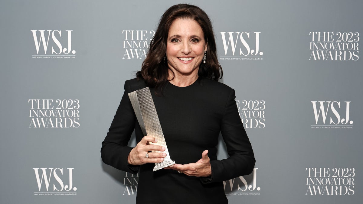 Julia Louis-Dreyfus holding an award