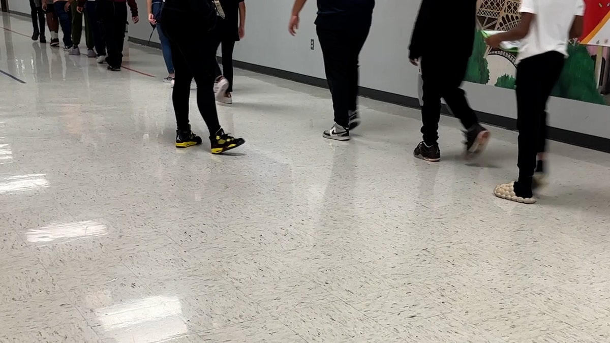 Students walking in hallway