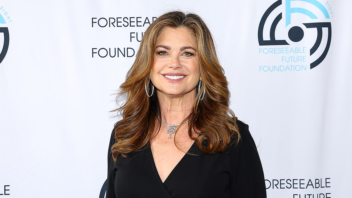 Kathy Ireland smiling on red carpet